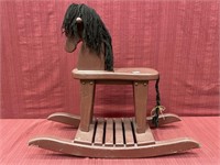Painted rocking horse with yarn, main and towel,