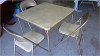 Samsonite table and 3 padded chairs