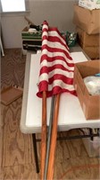 American flag on wooden pole, with additional