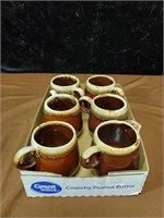 Group of 6 McCoy cups one is a creamer