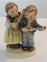 Hummel boy and girl playing ukulele