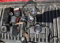 Box of untested cameras and accessories