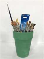 Terracotta pot of paint brushes
