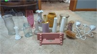 MANY DIFFERENT KINDS OF VASES WITH WALL HANGINGS