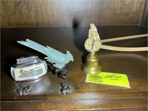 Group of decorative items including bell and bird
