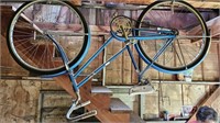 Vintage Blue Bicycle hanging in Garage