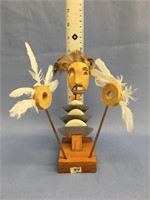 8 1/2" tall, very unique wood and feather spirit m