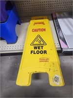 pair of wet floor signs