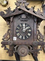 A very early antique cuckoo clock has all the