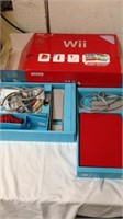Nintendo Wii complete with cords and controllers