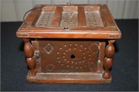 Antique carriage heater with brickette and