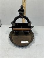 Cast iron boot scraper with boy on a ledge