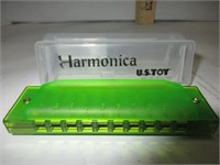 U. S. Toy, lime green harmonica.