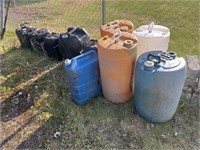 lot with plastic water jugs, and gas cans