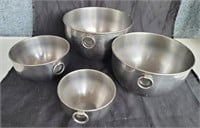 Stainless steel revere ware mixing bowls.