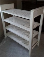 White painted shelf with caning in shelves