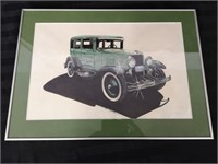 Nicely framed vintage car picture.