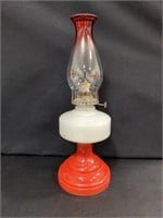 Vintage white oil lamp with red base and red top