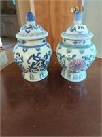 2 urns with lids. One blue pattern, one with