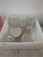 Clear glass coasters and glasses. Glassware