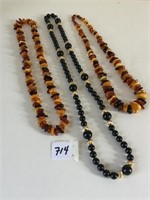 BLACK AND GOLD BEADED NECKLACE TWO FAUX AMBER