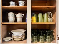 Contents of Kitchen Cabinet Including Mugs, Wine