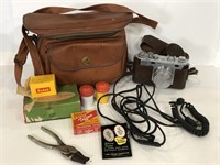 Vintage Nikon camera with bag and accessories