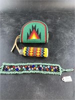An intricately beaded coin purse and lighter in Na