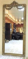 Shell and Swag Crowned Gilt Framed Beveled Mirror.