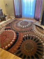 Large area rug with geometric patterns