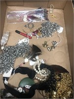 Flat of costume jewelry