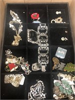 Flat of costume jewelry