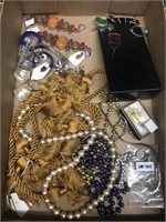 Flat of costume jewelry