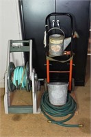 Lot: Hose reel, dolly, bucket and watering can; as