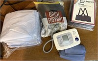 2 back supports, blood pressure machine, and