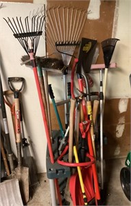 Group of long handle tools in rack