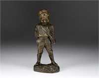 BRONZE FIGURE OF A YOUNG BOY