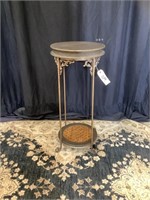 Beautiful scrolled iron plant stand.