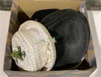 Box contains four hats - the white one is made by