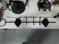 Cast iron coat rack with decorative horses