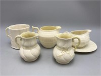 Belleek cups, creamer's, a miniature pitchers