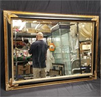 Black and gilt frame wall mirror