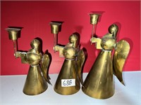 THREE BRASS ANGEL CANDLE HOLDERS