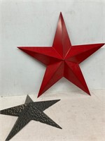 2 tin stars. 24” and 36”