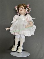 Porcelain doll pink dress