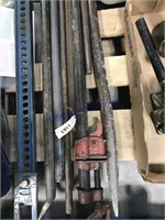 Pile of pry bars, pipe clamp