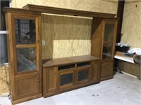 Lighted entertainment center with glass shelves
