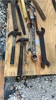Lot of hammers, wrenches, and axes