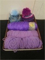 Three skeins of yarn and two hat making kits