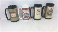 Four assorted beer mugs